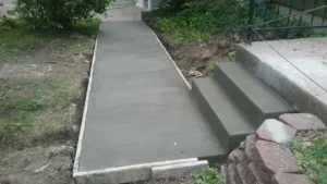 a concrete path and stairs under construction